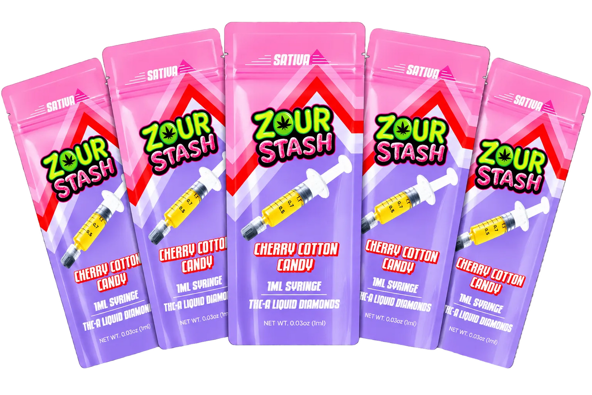 Five pouches of Sour Stash Cherry Cotton Candy arranged in a fan shape on a gray and white checkered background. The packaging is pink and purple with a syringe graphic and the Sour Stash logo.